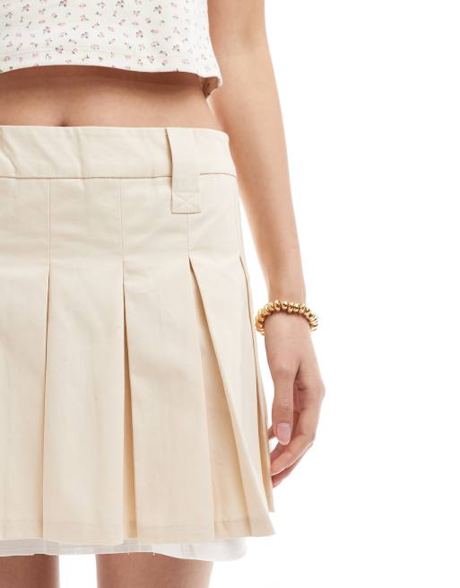 Monki pleated mini skirt with white layered raw hem detail in beige