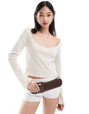 Monki pointelle long sleeve top with open neck in beige-Neutral