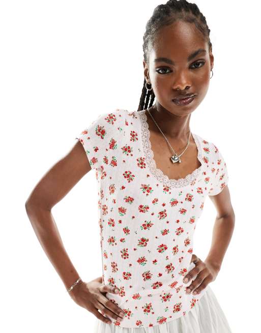 Monki pointelle top with scoop neck and lace trim in pink and red floral print