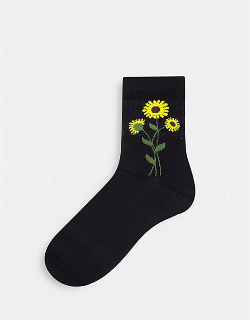 Monki Polly organic cotton sunflower socks in black