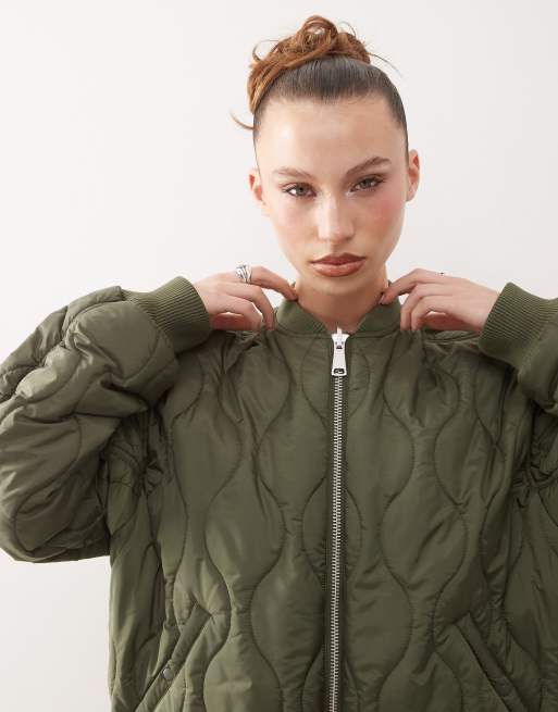 Monki quilted reversible bomber jacket in khaki with floral