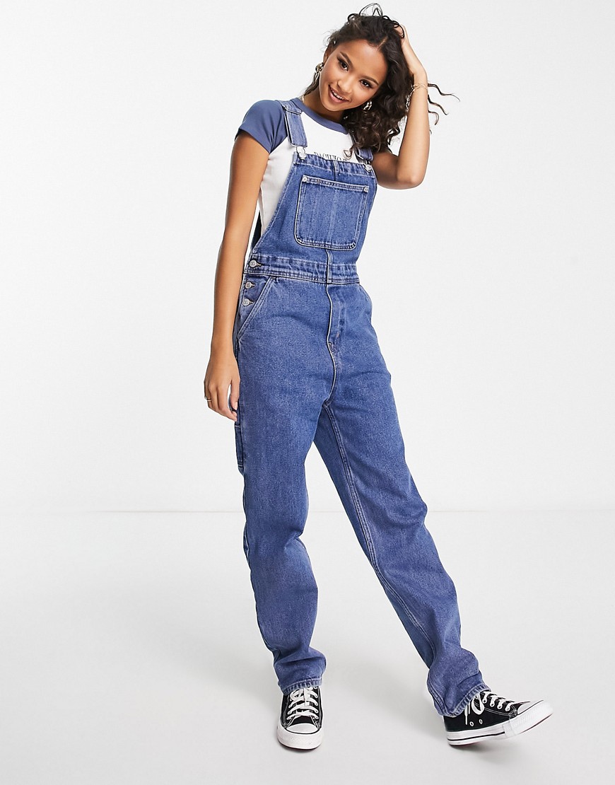 Monki relaxed overalls with contrast detail in light wash denim-Blue