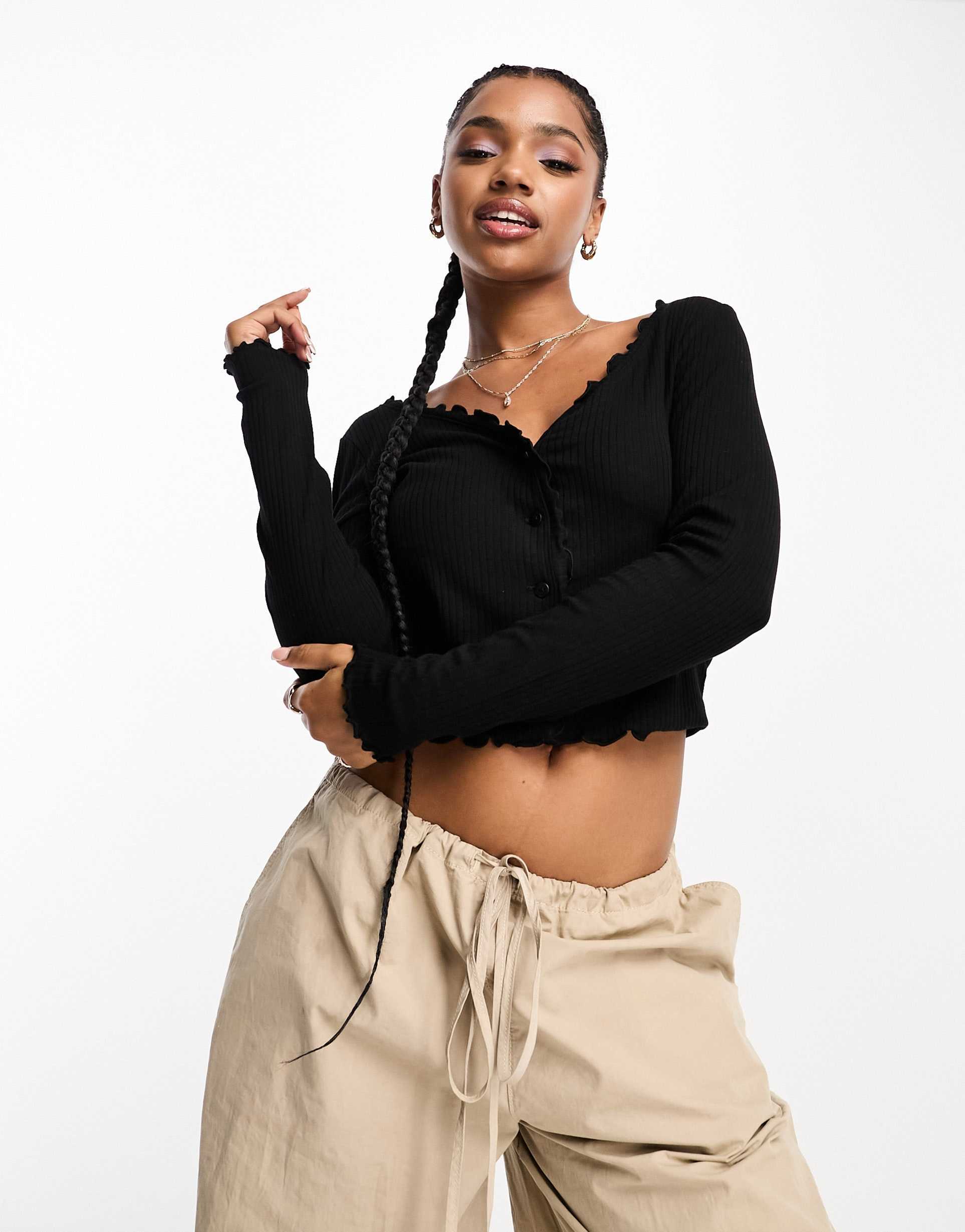 monki ribbed button front long sleeve top with lettuce edge in black