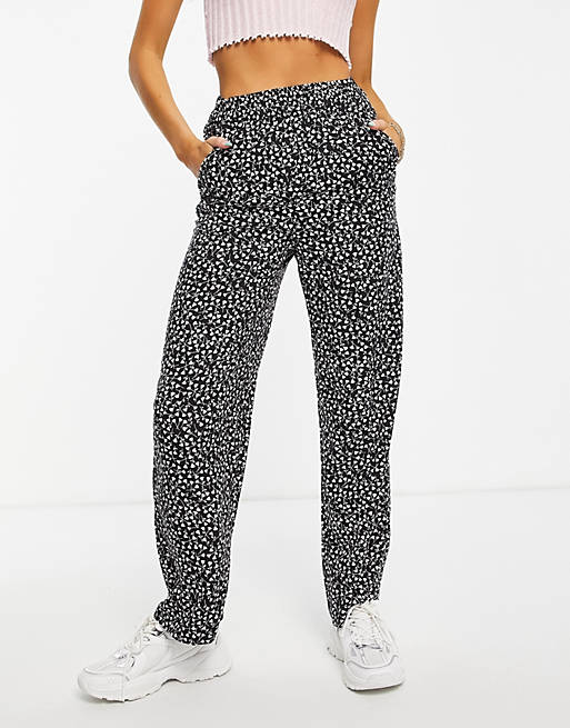 Monki Rosie pull on wide leg trousers in black floral print