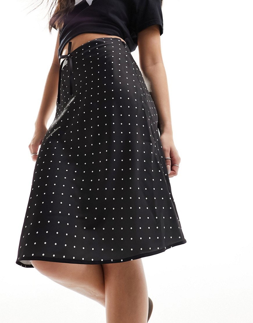 Monki satin a-line midi skirt with front bow detail in black and white polka dot