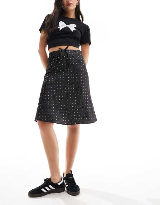 Monki satin a line midi skirt with front bow detail in black and white polka dot