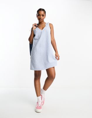 Monki seersucker bow tie strap mini dress with side pockets in blue and white stripe