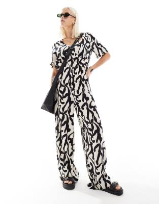 Monki short sleeve jumpsuit with wrap front in bold mono abstract print