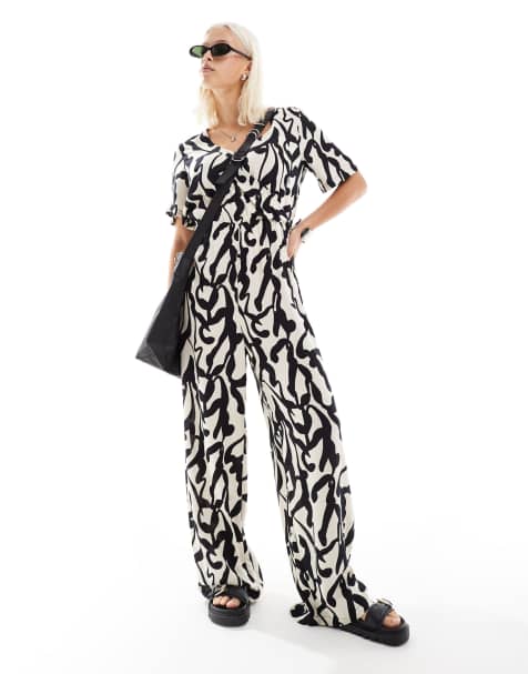 Monki short sleeve jumpsuit with wrap front in bold mono abstract print - view 1