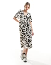 ASOS DESIGN sleeveless washed midi dress with cut out back and graphic detail 