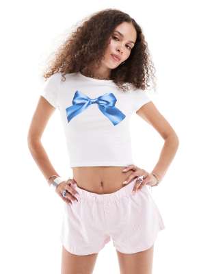 Monki short sleeve shrunken baby tee in white with blue bow graphic print