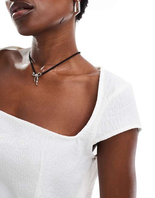 Monki short sleeve square neck top with open back in off white