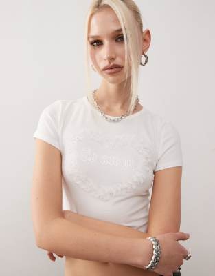 Monki shrunken fit top with frill heart graphic in white