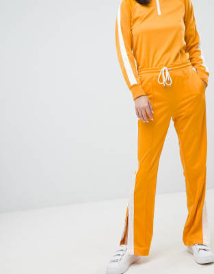 mustard track pants
