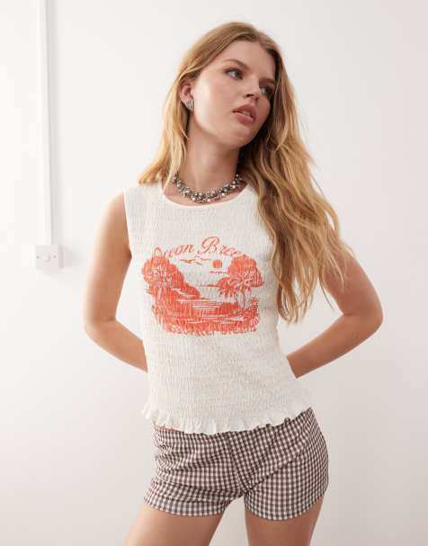 Monki smock shirred sleeveless tank with frill edge and contrast orange 'Ocean Breeze' print in white