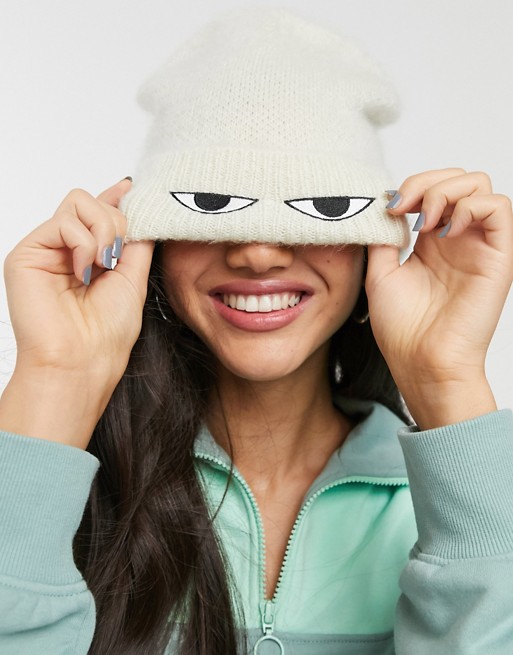 Monki soft beanie with ribbed turnup and eye print in off white