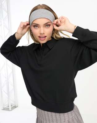 Monki - Sweatshirt in Schwarz mit Polokragen