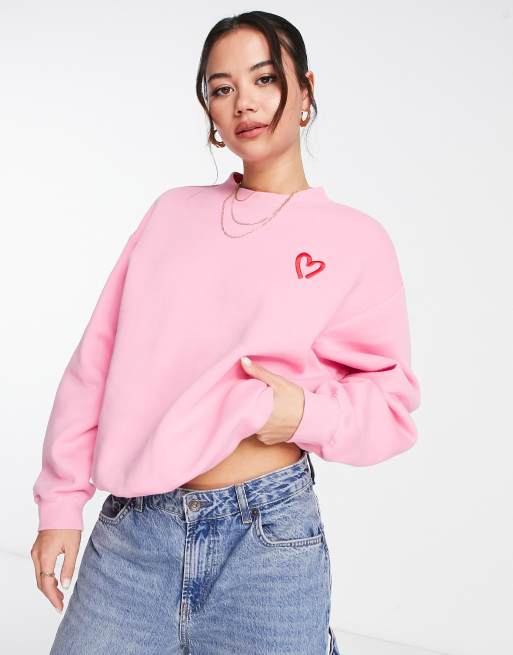 Monki sweatshirt with heart embroidery in pink | ASOS