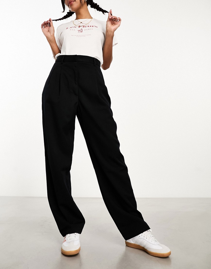 Monki tapered leg trousers with pleat front in black