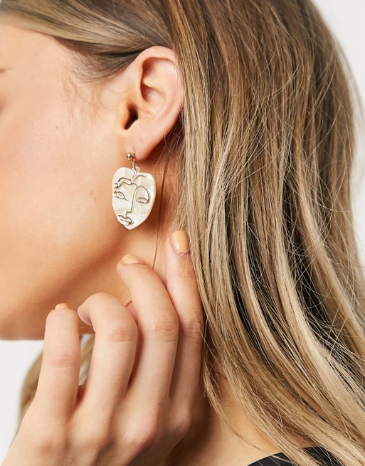 Monki Telle face earrings in gold
