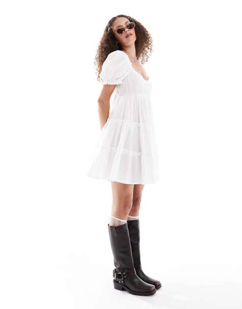Monki textured babydoll mini dress with tiered hem and puff sleeves in white - view 1
