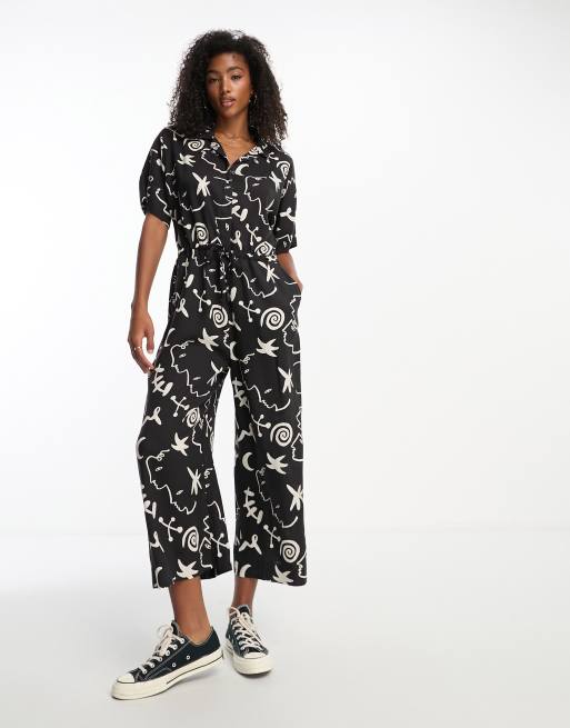 Monki tie waist jumpsuit in black and white face and moon print