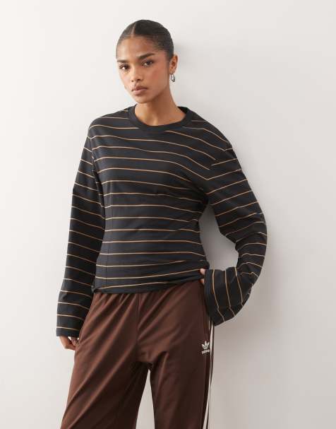 Monki - Top a maniche lunghe strutturato in jersey nero a righe stretto in vita - view 1