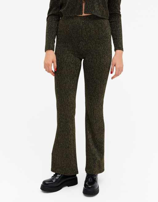 Monki - Tora - Pantaloni a zampa nero e oro glitter