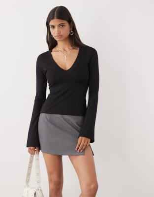 Monki V-neck Long Sleeve T-shirt With Trumpet Sleeves And Panel Detail In Black