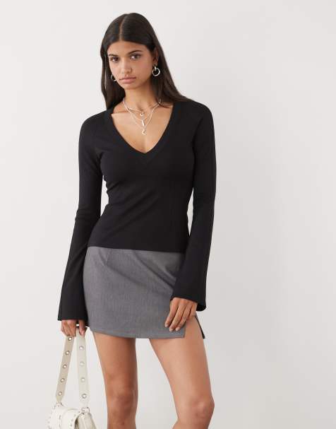 Monki V-neck long sleeve T-shirt with trumpet sleeves and panel detail in black - view 1