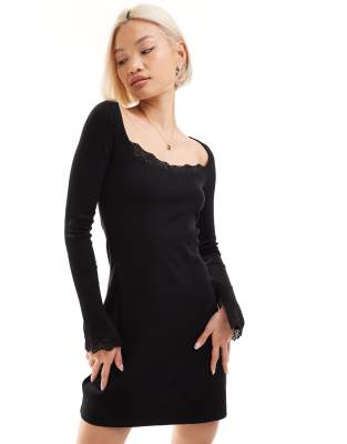 Monki - Vestito corto a maniche lunghe nero con dettagli in pizzo