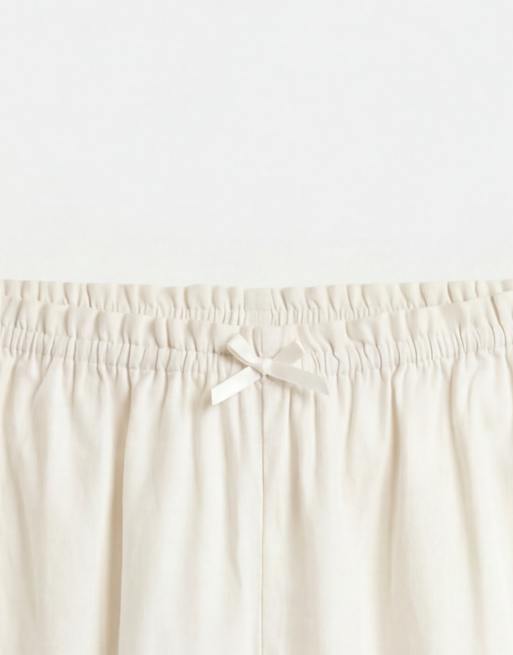 Monki – Vita, blommiga jeansshorts i broderie anglaise, 8 av 9