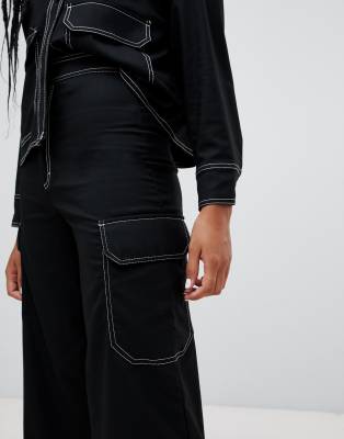 black cargo trousers with white stitching
