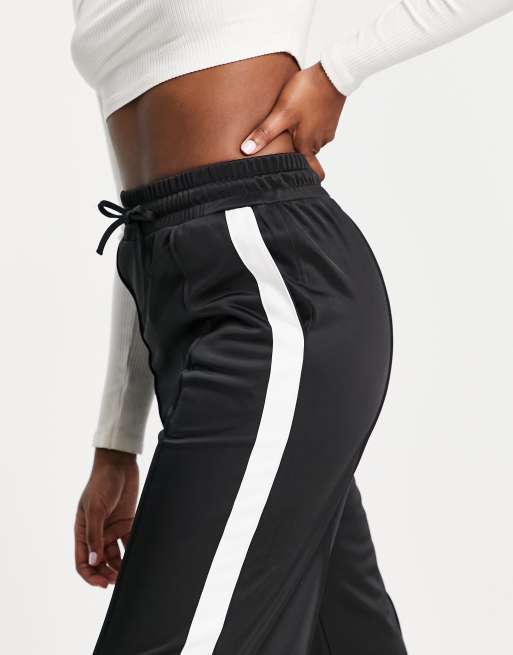 Black trousers store with white stripe