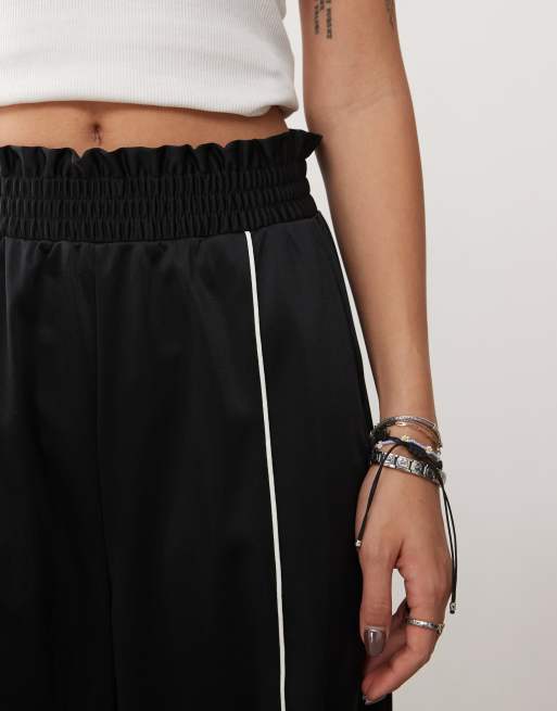 Monki wide leg pull-on track pants with front stripe in black | ASOS