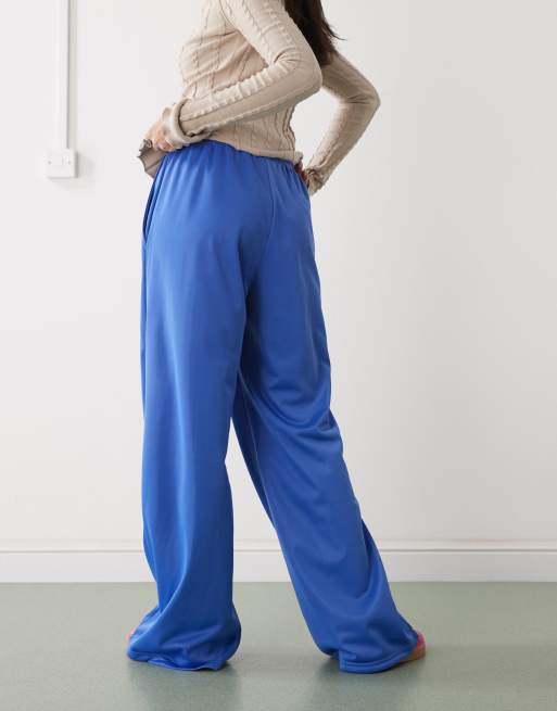 Monki wide leg pull on track pants with white piping in blue | ASOS