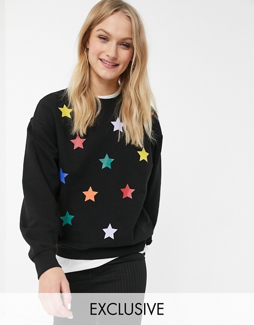 Monki Christmas rainbow star print sweater in black