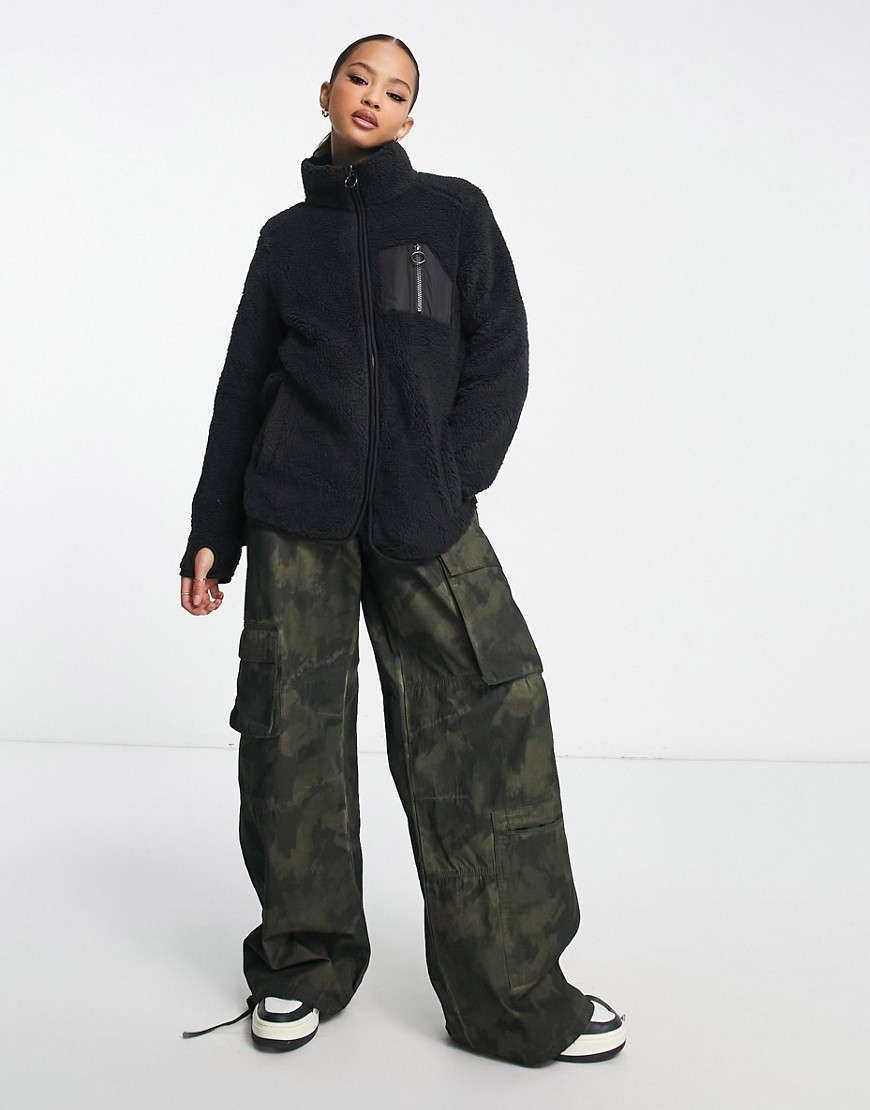 Monki zip fleece with patch pockets in black