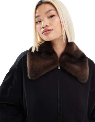 Monki zip front jacket in black with contrast faux fur