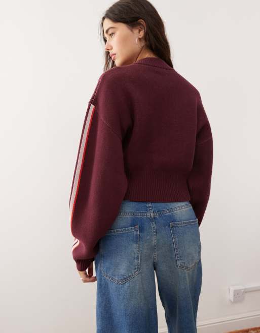 Monki zip up knit bomber cardigan in burgundy with 'slightly athletic' sporty graphic
