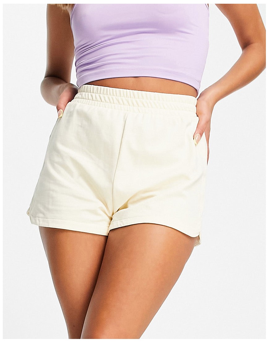 Monki Zoe organic cotton runner shorts in pale yellow