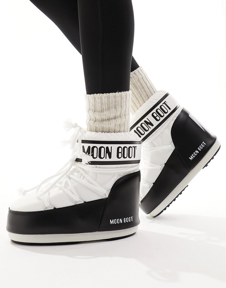 Moon Boot mid ankle snow boots in black and white