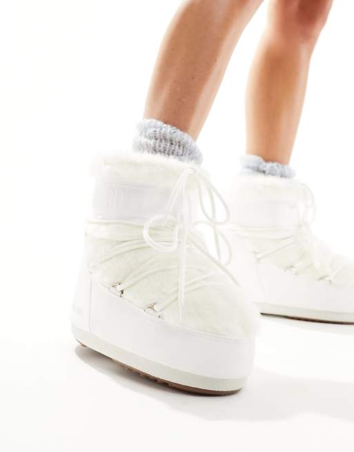 Moon Boot mid ankle snow boots in white faux fur