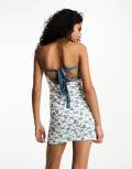 Motel bandeau mini dress with ribbon bow tie back in blue floral-White