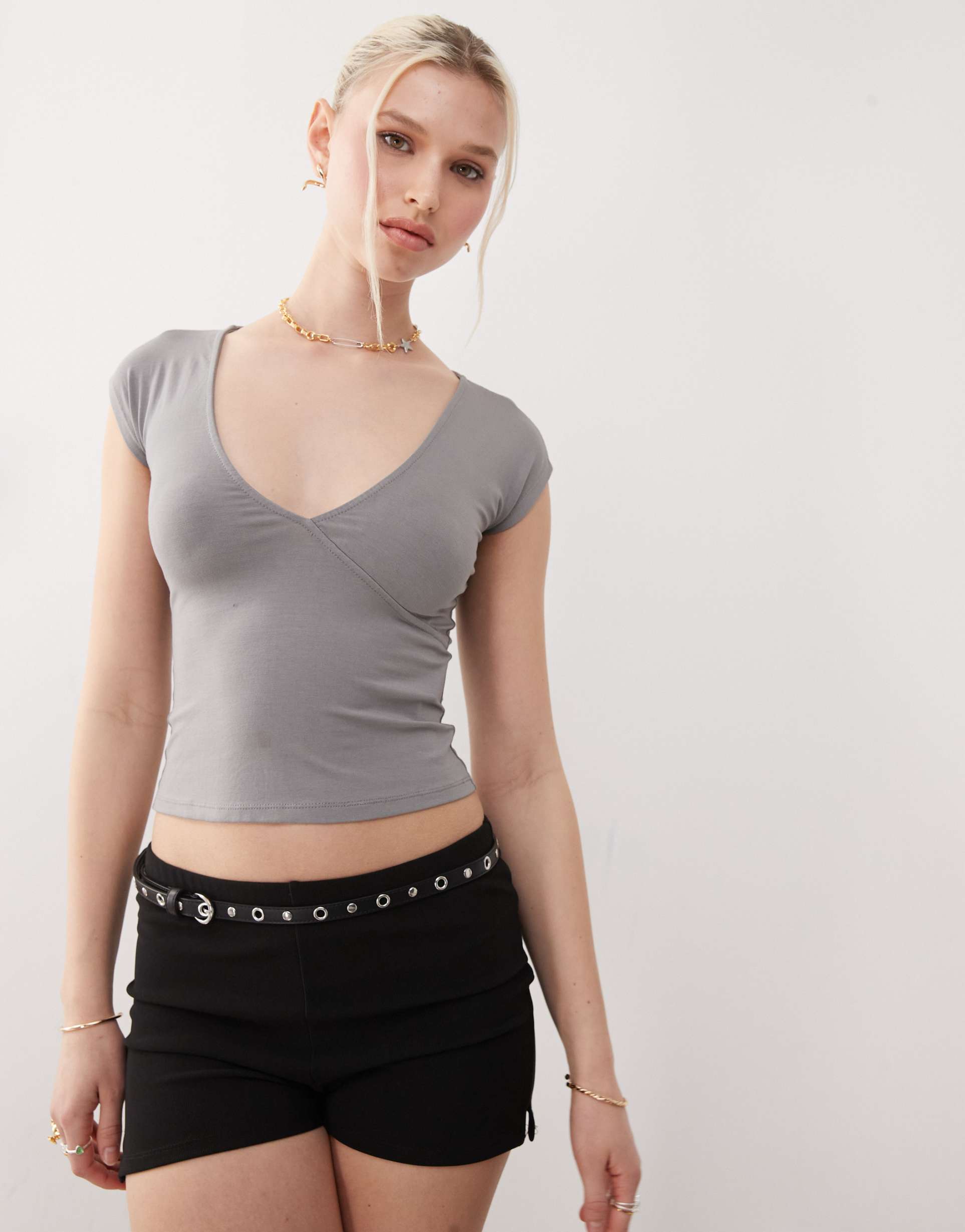 motel dolores wrap v-neck top in gray