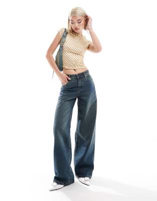 Motel extra wide low rise jeans in brown blue acid wash