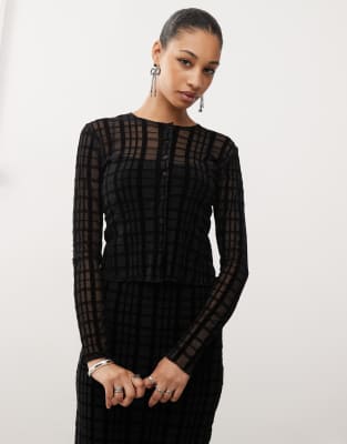 Thumbnail - Motel - Kahula - Micro-Strickjacke in Schwarz mit geflocktem Karomuster