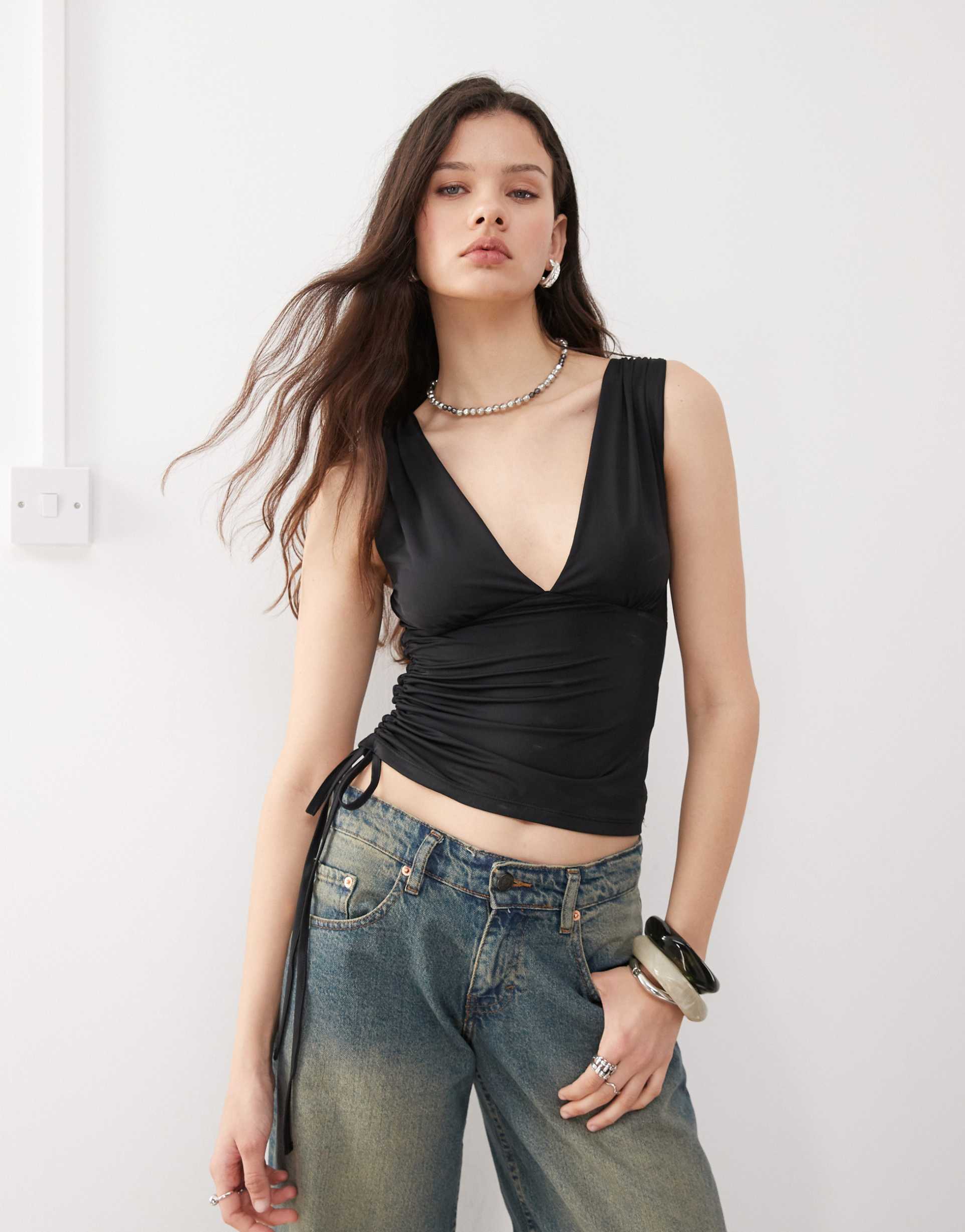 motel lindka plunge asymmetric slinky top in black