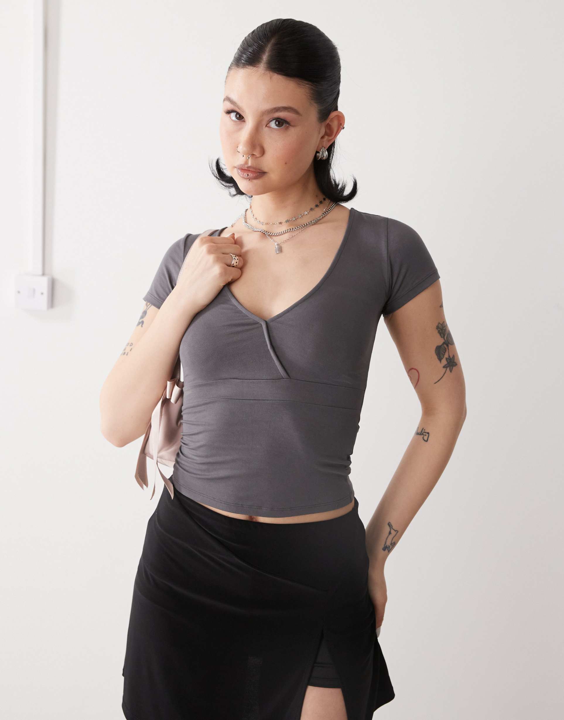 motel machiko plunge front wrap top in charcoal gray