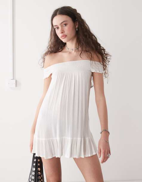 Motel - Melisandre - Hvid smock-minikjole med offshoulder-snit og broderie anglaise - view 1